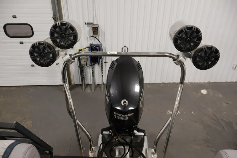 Slide: The Image of Sweetwater 2186 boat with Evinrude engine and mounted speakers, 2018 model. - 36