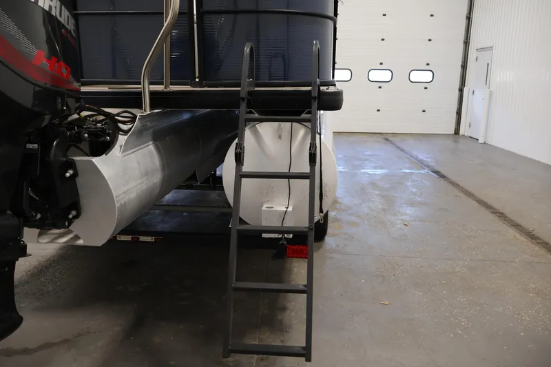 Slide: The Image of Rear view of 2018 Sweetwater 2186 pontoon boat in a garage. - 37