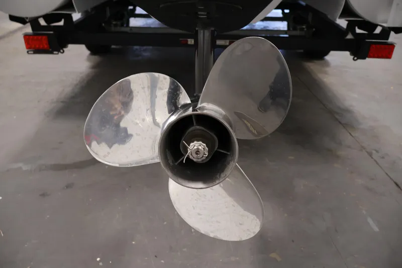 Slide: The Image of Close-up of a 2018 Sweetwater 2186 boat propeller in a garage setting. - 42