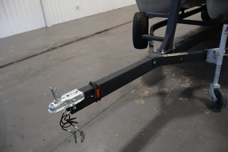 Slide: The Image of Trailer hitch of a 2018 Sweetwater 2186 boat in a garage setting. - 43