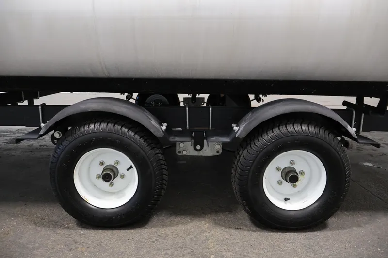 Slide: The Image of Close-up of Sweetwater 2186 trailer wheels, 2018 model, on a concrete surface. - 47