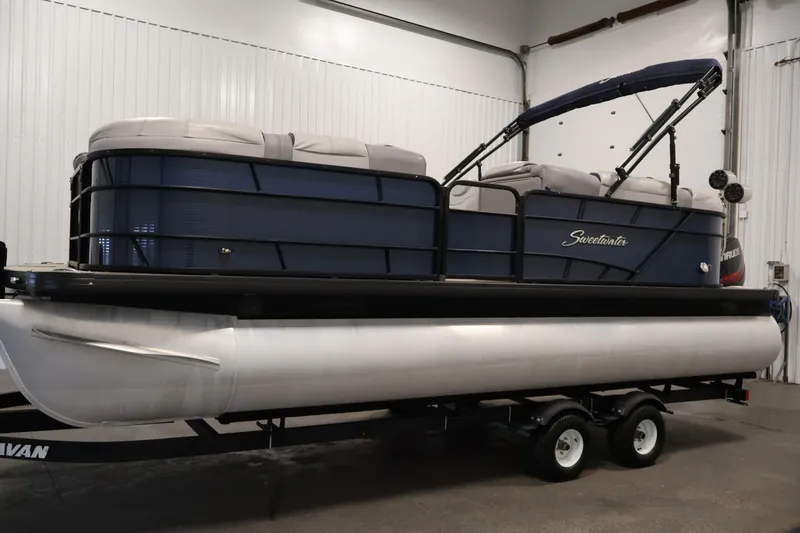 Slide: The Image of 2018 Sweetwater 2186 pontoon boat in a garage setting. - 8