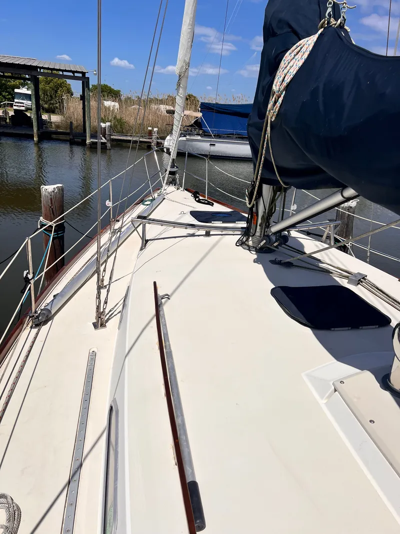 Slide: The Image of Deck of a 1990 Pearson 37-2 sailboat docked in harbor. - 21