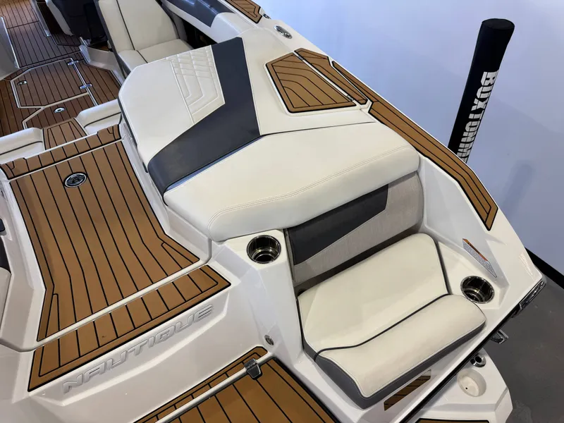 Slide: The Image of Interior of 2022 Nautique Super Air Nautique G23 with luxurious seating. - 11