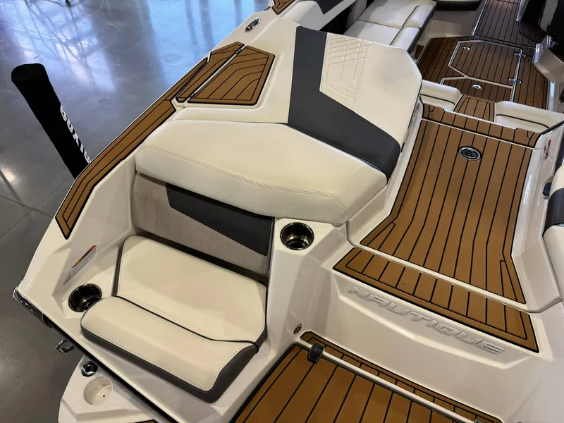 Slide: The Image of Interior of 2022 Nautique Super Air Nautique G23 with luxurious seating. - 12