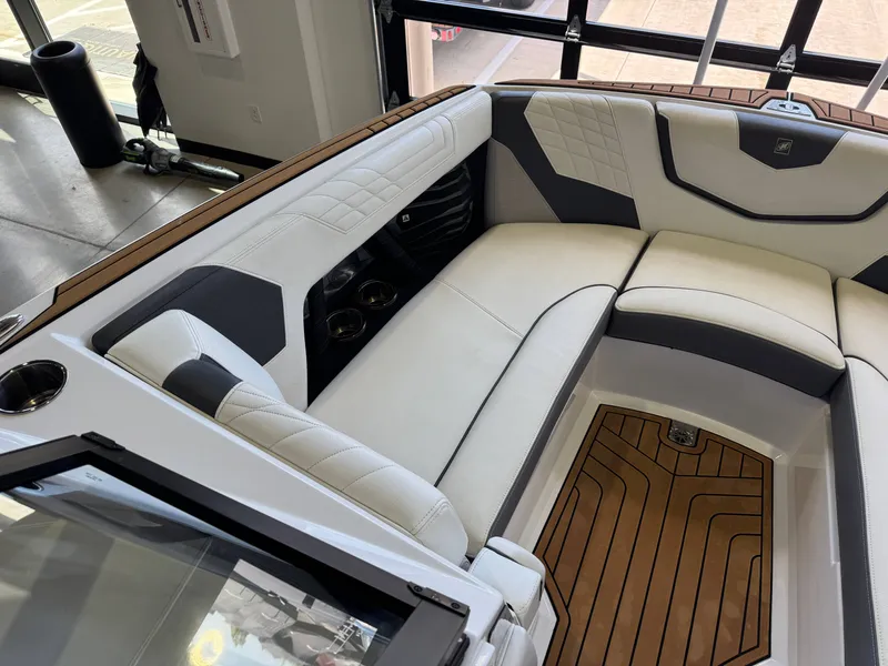 Slide: The Image of Interior of 2022 Nautique Super Air Nautique G23 with luxurious seating. - 19