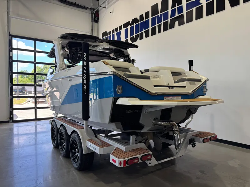 Slide: The Image of 2022 Nautique Super Air Nautique G23 boat in showroom. - 5