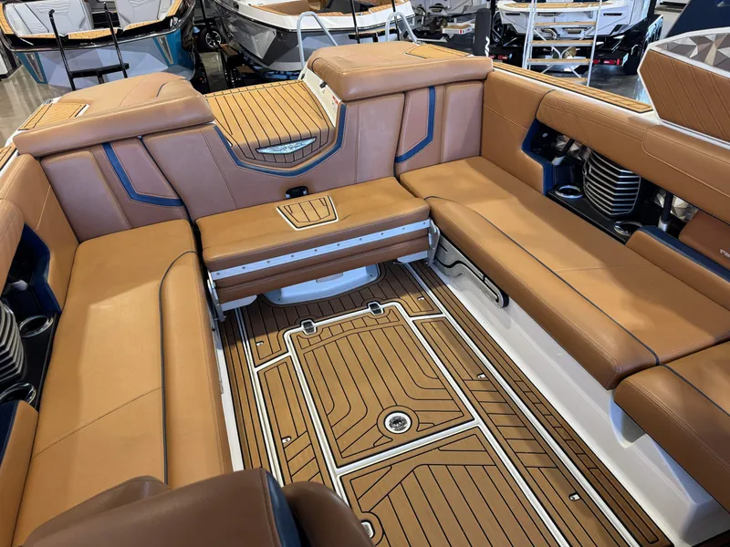 Slide: The Image of Interior of 2019 Nautique Super Air Nautique G25 boat with brown leather seating. - 16