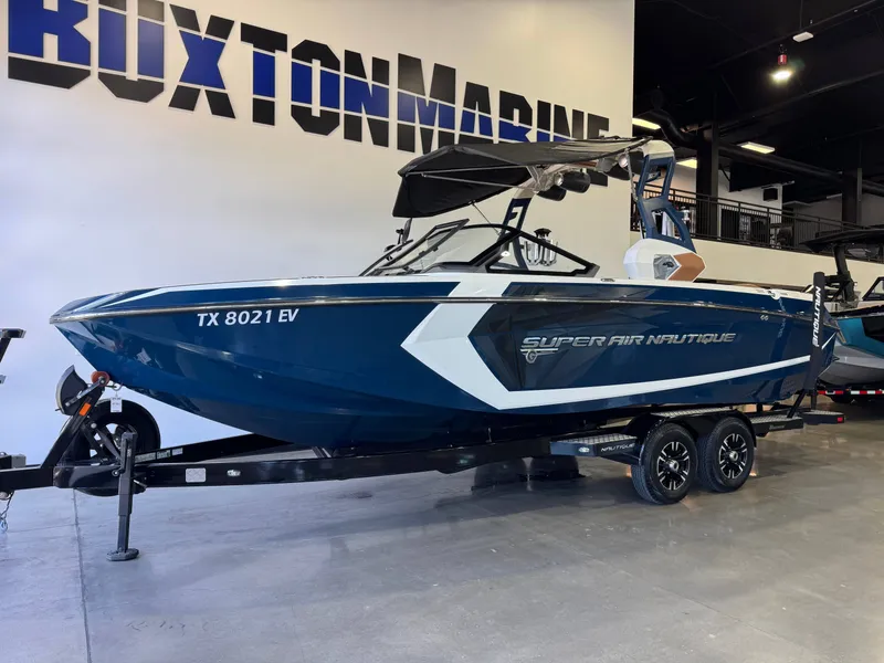 Slide: The Image of 2019 Nautique Super Air Nautique G25 boat in a showroom. - 3