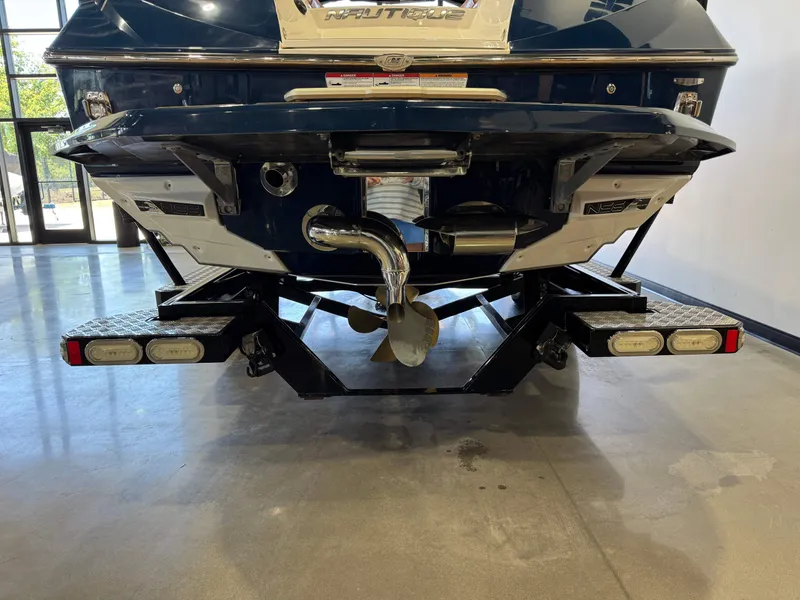 Slide: The Image of Rear view of a 2019 Nautique Super Air Nautique G25 boat. - 7