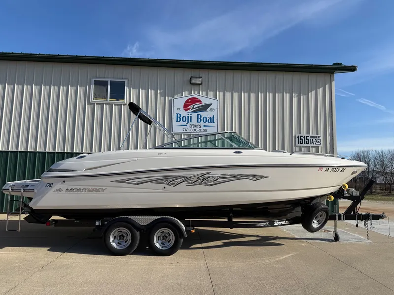 The Image of 2012 Monterey 264FS boat on trailer in front of Boji Boat building. - 0