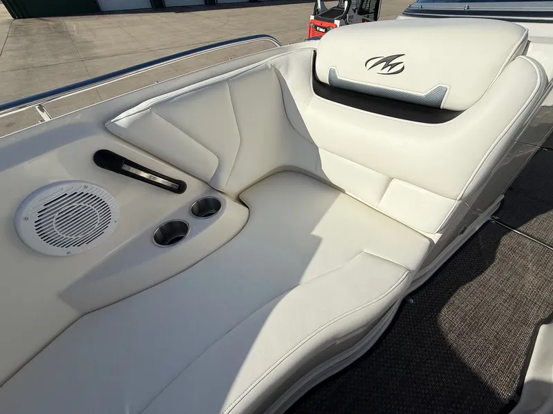Slide: The Image of Interior of a 2012 Monterey 264FS boat with white seating. - 10