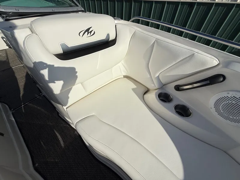 Slide: The Image of Interior of a 2012 Monterey 264FS boat with white seating. - 11