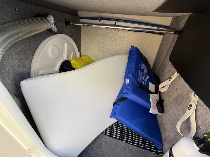 Slide: The Image of Interior of a 2012 Monterey 264FS boat with safety equipment. - 12
