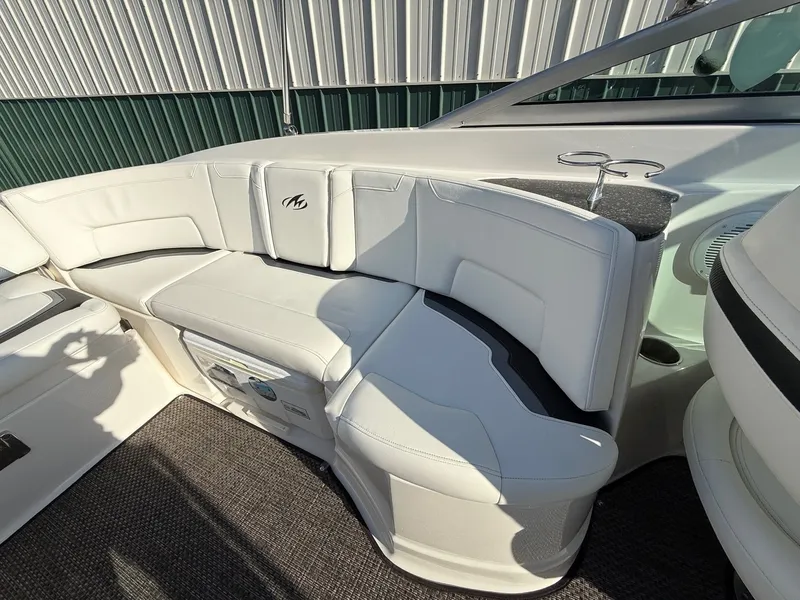 Slide: The Image of Interior of a 2012 Monterey 264FS boat with white seating. - 21