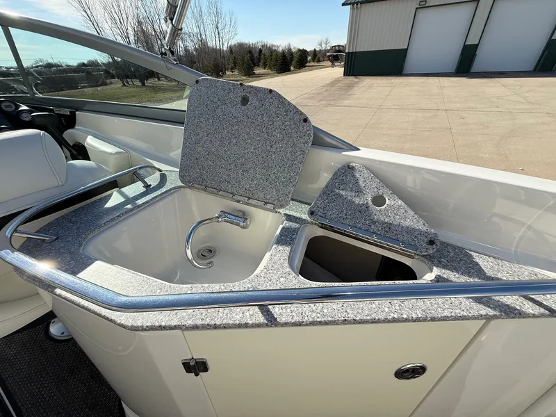 Slide: The Image of Monterey 264FS 2012 boat kitchenette with sink and storage. - 24