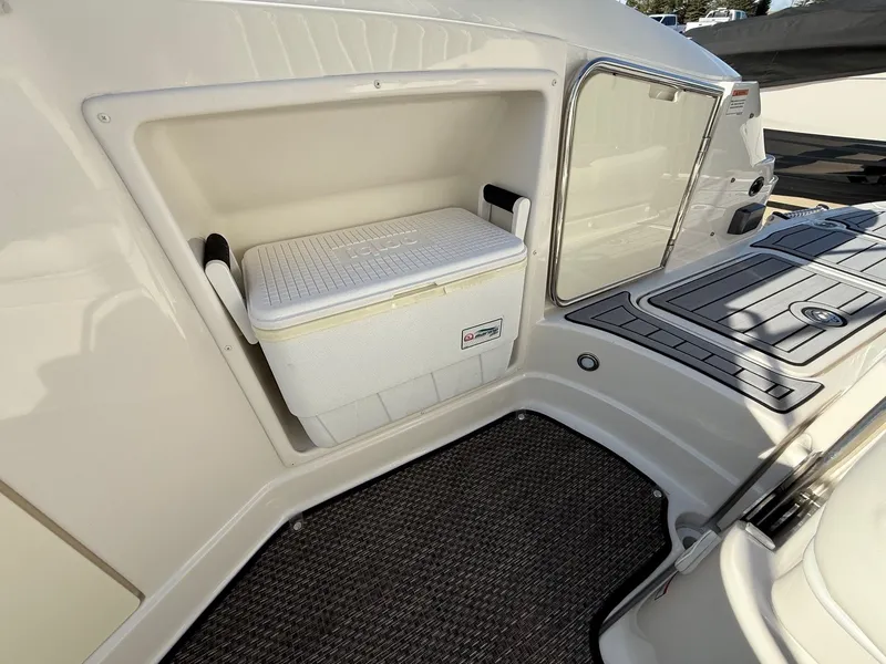 Slide: The Image of 2012 Monterey 264FS boat with built-in cooler on deck. - 27