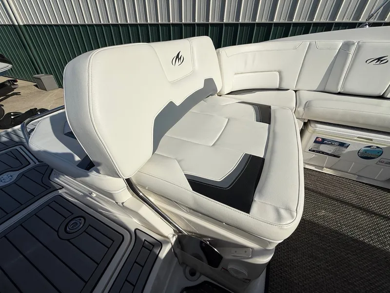 Slide: The Image of Interior of a 2012 Monterey 264FS boat with white seating. - 28