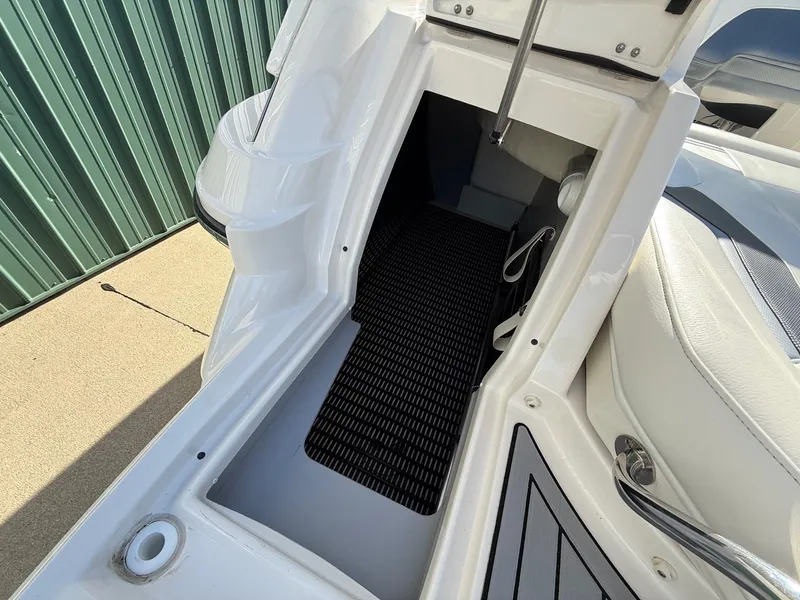 Slide: The Image of Interior of a 2012 Monterey 264FS boat with storage space. - 30