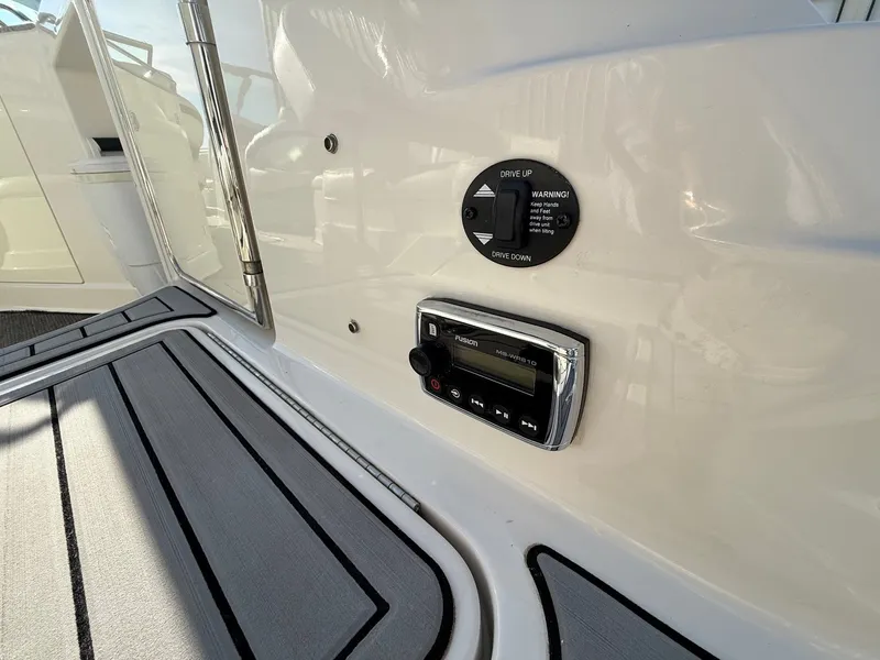 Slide: The Image of Monterey 264FS 2012 boat console with controls and radio. - 31