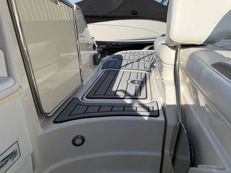 Slide: The Image of Interior of a 2012 Monterey 264FS boat with seating area. - 32