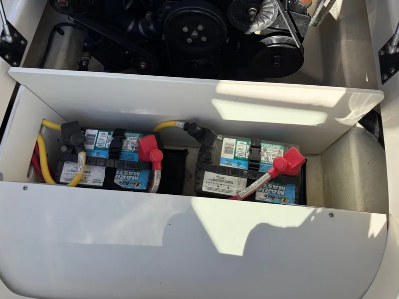 Slide: The Image of Batteries in the engine compartment of a 2012 Monterey 264FS boat. - 36