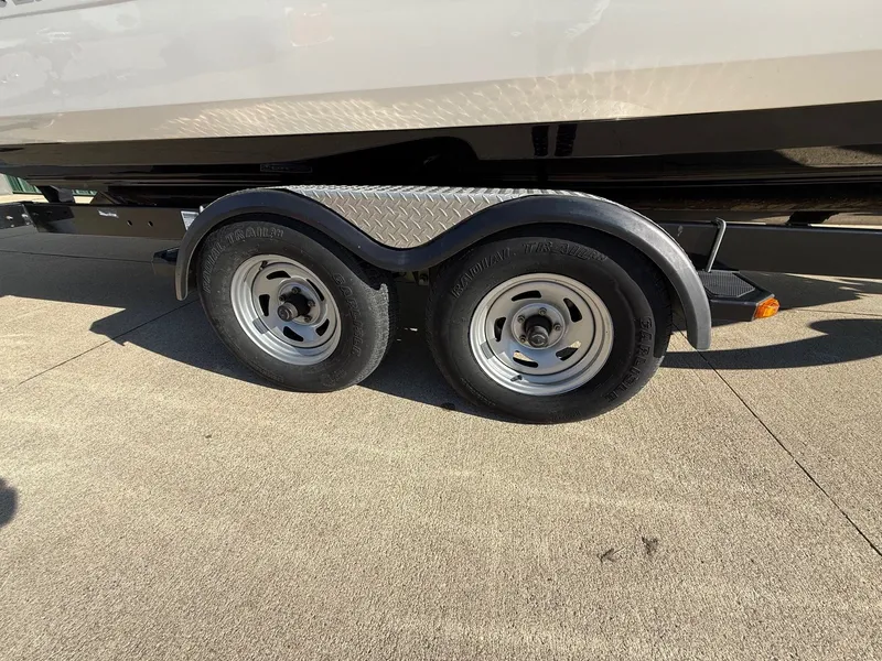 Slide: The Image of Trailer tires of a 2012 Monterey 264FS boat on concrete. - 37