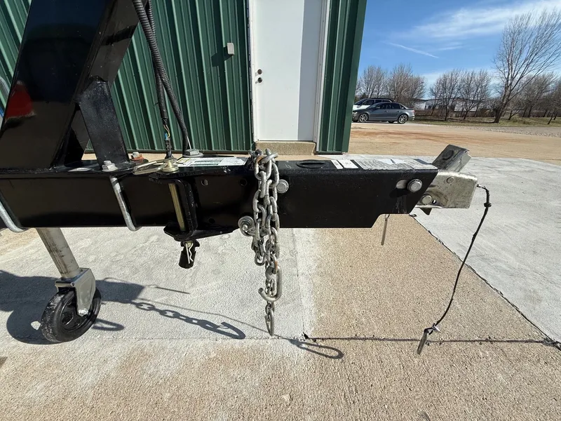 Slide: The Image of Trailer hitch of a 2012 Monterey 264FS in front of green building. - 39