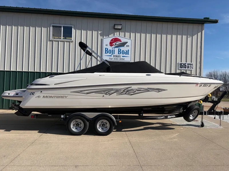 Slide: The Image of 2012 Monterey 264FS boat on trailer outside Boji Boat building. - 40