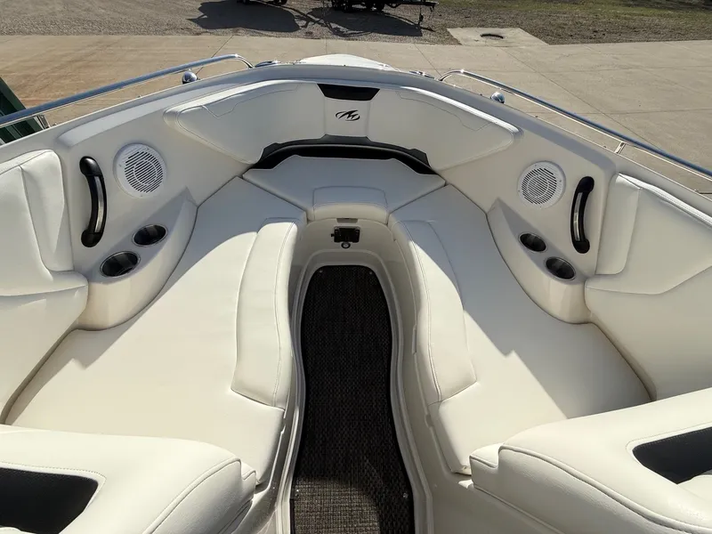 Slide: The Image of Interior of a 2012 Monterey 264FS boat with white seating. - 8