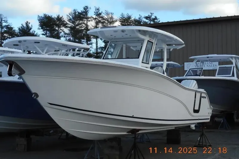 The Image of 2026 Sea Fox 288 Commander boat displayed outdoors, surrounded by trees and other boats. - 1