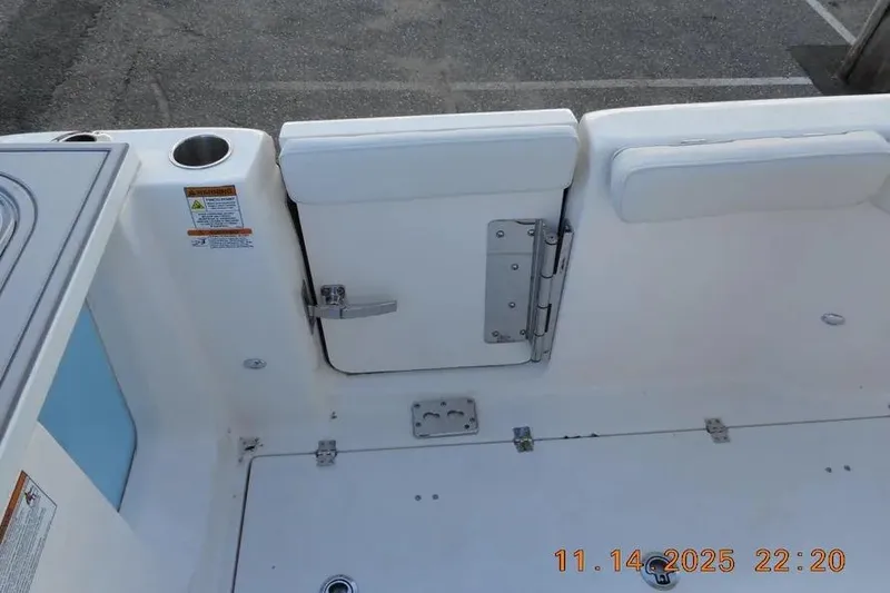 Slide: The Image of 2026 Sea Fox 288 Commander boat interior with white seating and storage compartment. - 11