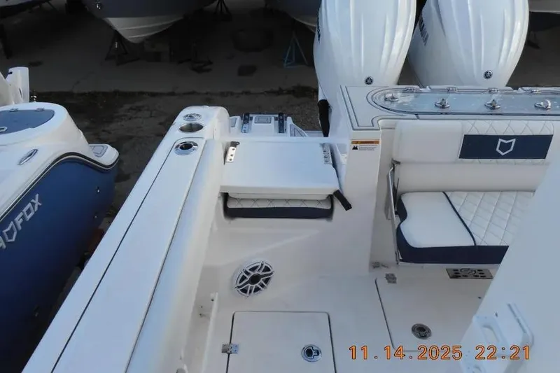 Slide: The Image of 2026 Sea Fox 288 Commander boat interior with seating and dual engines. - 15
