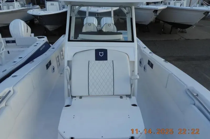 Slide: The Image of 2026 Sea Fox 288 Commander boat interior with white seating and console. - 18