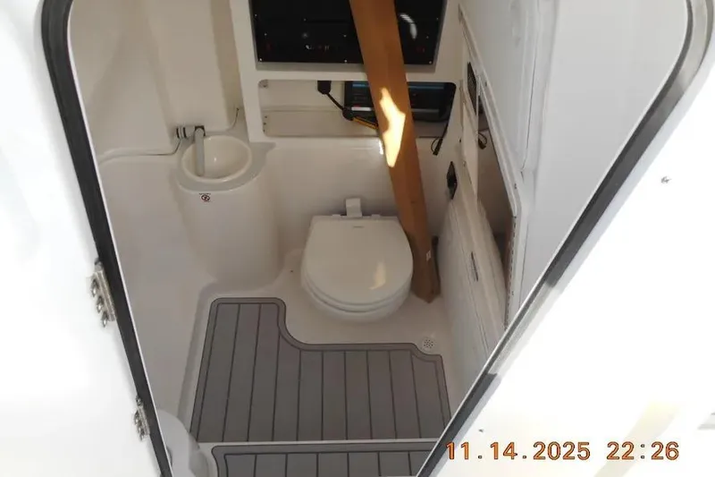 Slide: The Image of Interior of 2026 Sea Fox 288 Commander boat bathroom with toilet and sink. - 25