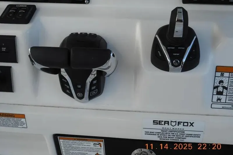 Slide: The Image of Control panel of a 2026 Sea Fox 288 Commander boat with throttle and joystick. - 7