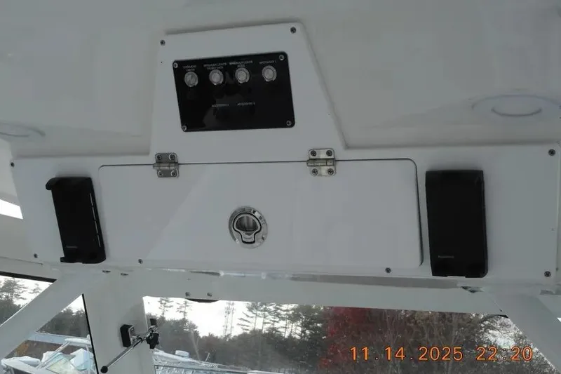 Slide: The Image of Control panel of 2026 Sea Fox 288 Commander boat with switches and storage compartment. - 8