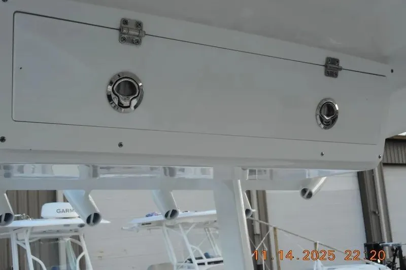 Slide: The Image of 2026 Sea Fox 288 Commander boat storage compartment with secure latches. - 9