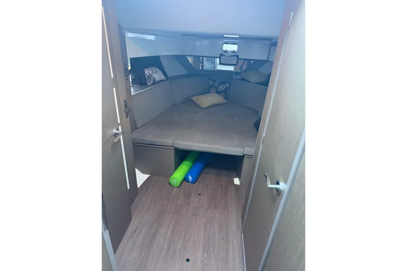 Slide: The Image of Interior cabin of 2023 Beneteau Gran Turismo 32 with cozy seating and cushions. - 11