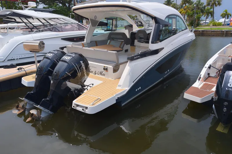 The Image of 2023 Beneteau Gran Turismo 32 yacht docked, featuring dual Mercury outboard engines. - 12