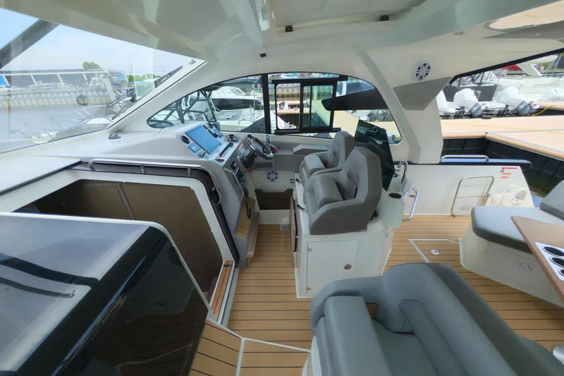 Slide: The Image of Interior view of 2023 Beneteau Gran Turismo 32 yacht with modern helm and seating. - 21