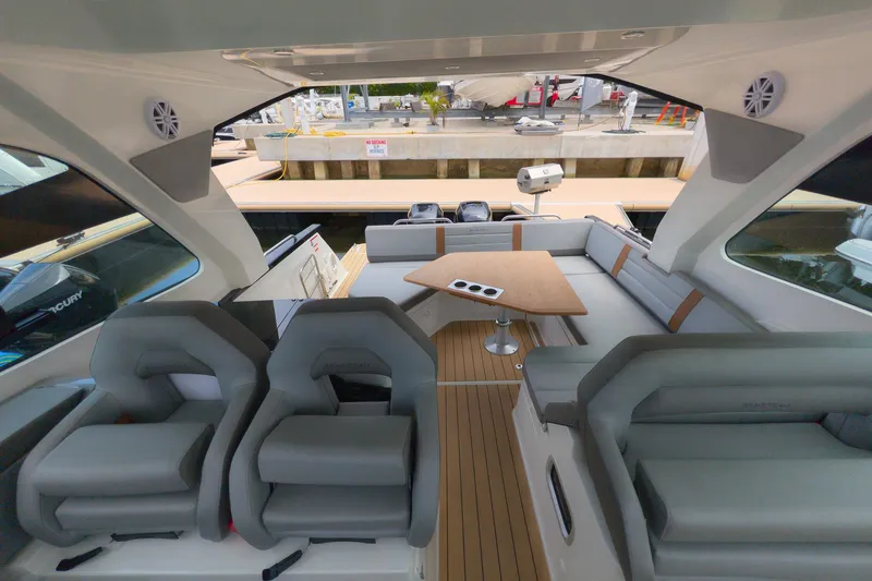 Slide: The Image of Interior of 2023 Beneteau Gran Turismo 32 yacht with modern seating and table. - 25