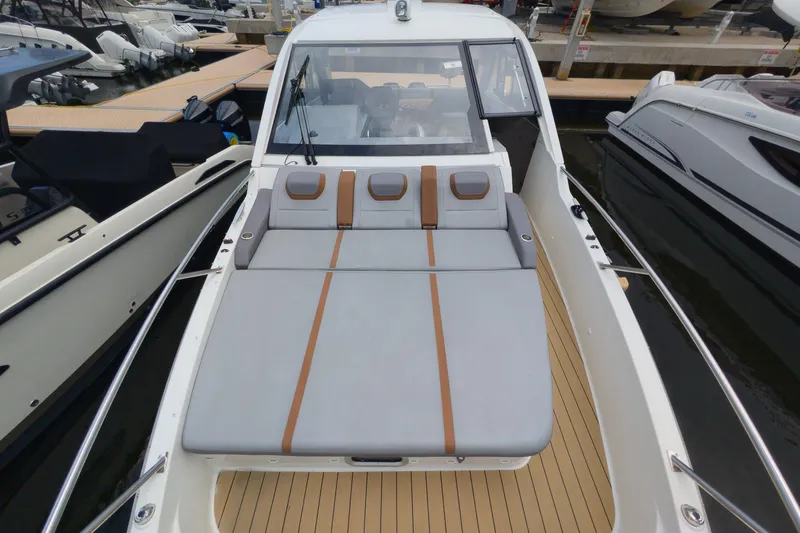 Slide: The Image of 2023 Beneteau Gran Turismo 32 yacht with spacious sunbed at marina dock. - 27