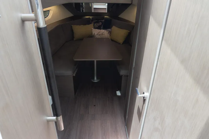 Slide: The Image of Interior cabin of 2023 Beneteau Gran Turismo 32 with cozy seating and table. - 28