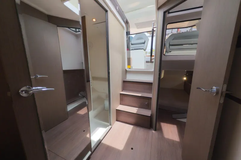Slide: The Image of Interior of 2023 Beneteau Gran Turismo 32 yacht, featuring modern wood finishes and compact design. - 33