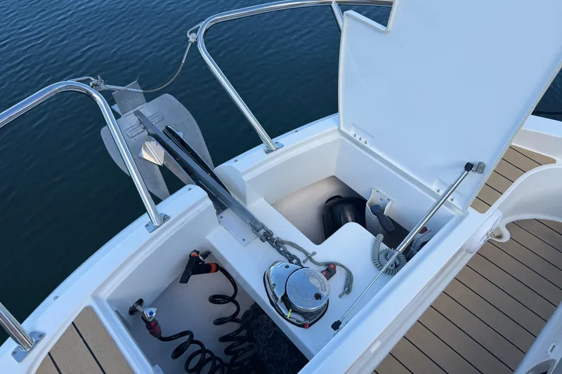 Slide: The Image of 2023 Beneteau Gran Turismo 32 anchor locker with open hatch, showing equipment storage. - 4
