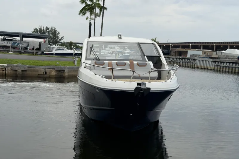 Slide: The Image of 2023 Beneteau Gran Turismo 32 yacht docked in a marina, front view. - 51
