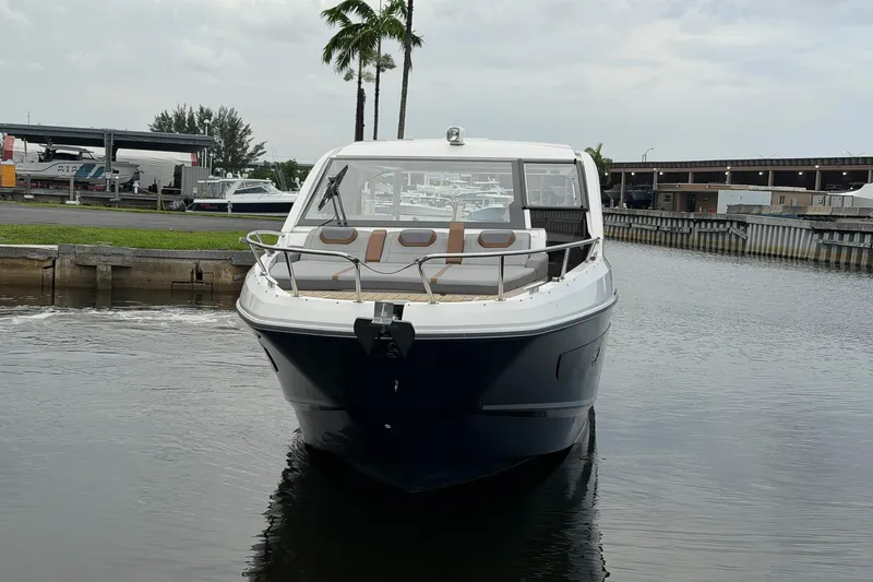 Slide: The Image of 2023 Beneteau Gran Turismo 32 yacht docked in a marina, front view. - 52