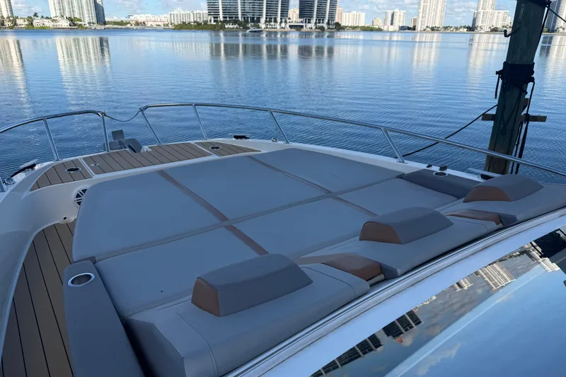 Slide: The Image of 2023 Beneteau Gran Turismo 32 yacht with spacious deck and waterfront city view. - 6
