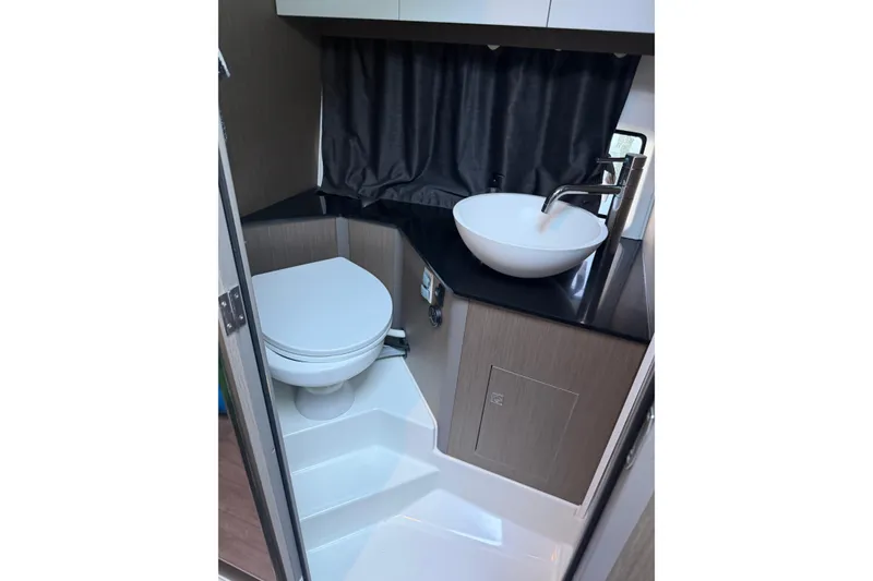 Slide: The Image of Modern bathroom in 2023 Beneteau Gran Turismo 32 yacht with sleek sink and toilet. - 8